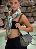 Green silk scarf and green leather saddle bag